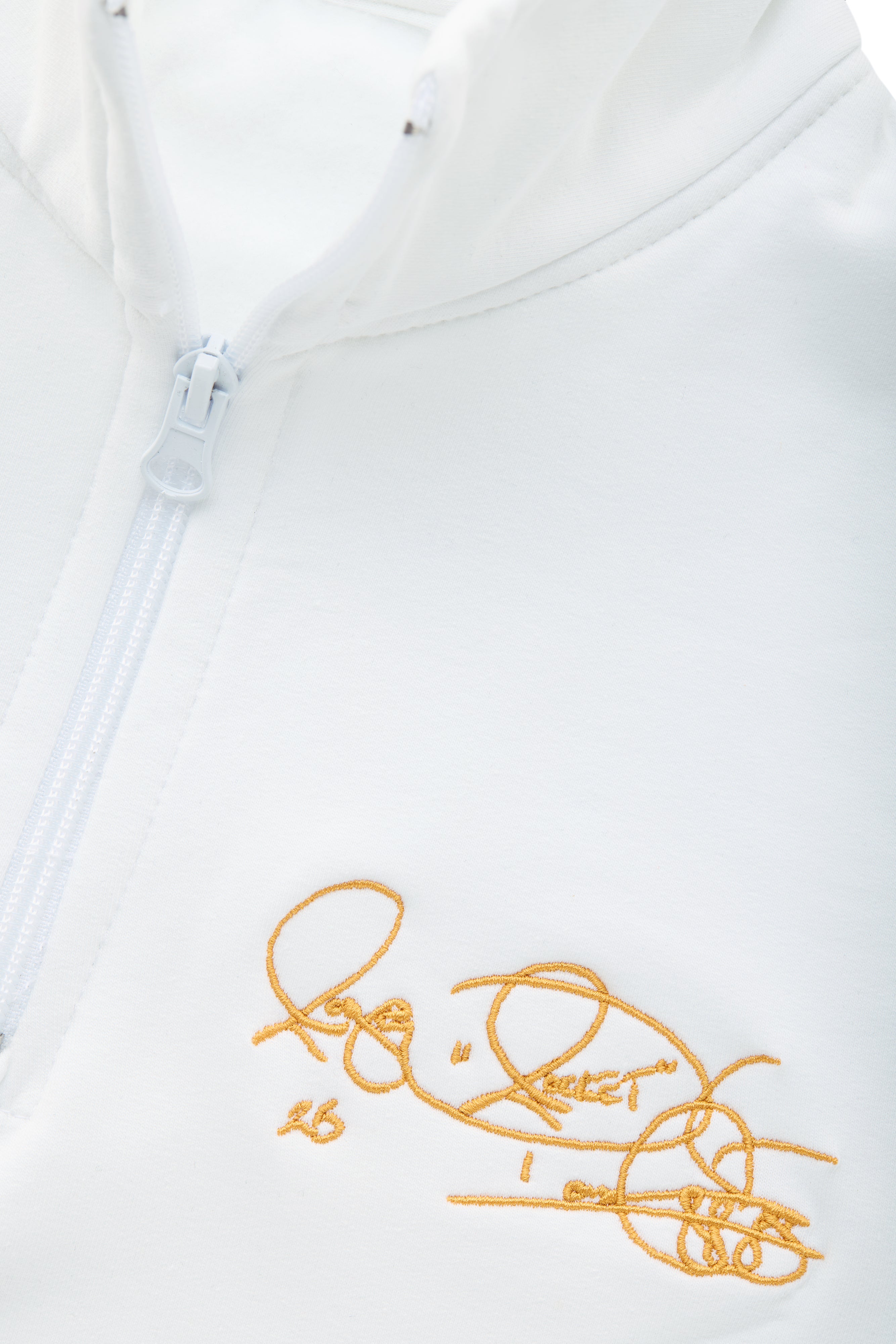 Women’s Notre Dame pullover in white with Rocket Ismail embroidered signature in gold — officially licensed Fighting Irish sweatshirt.